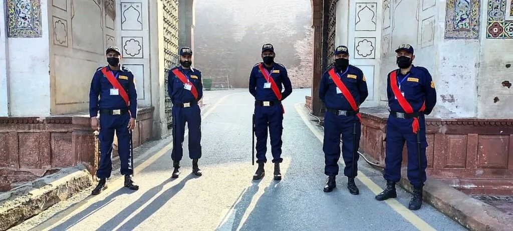 Professional armed security guards on patrol in Lahore